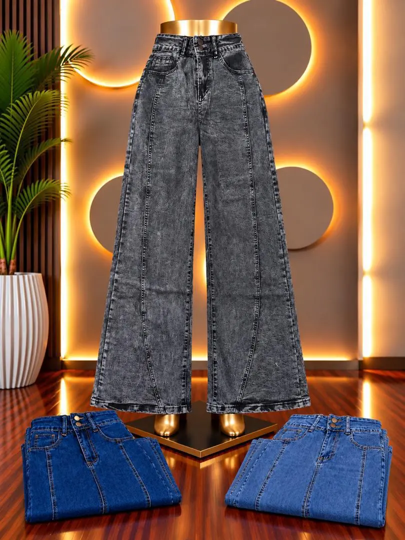 Grey acid-wash wide-leg jeans with folded blue jeans beside it
